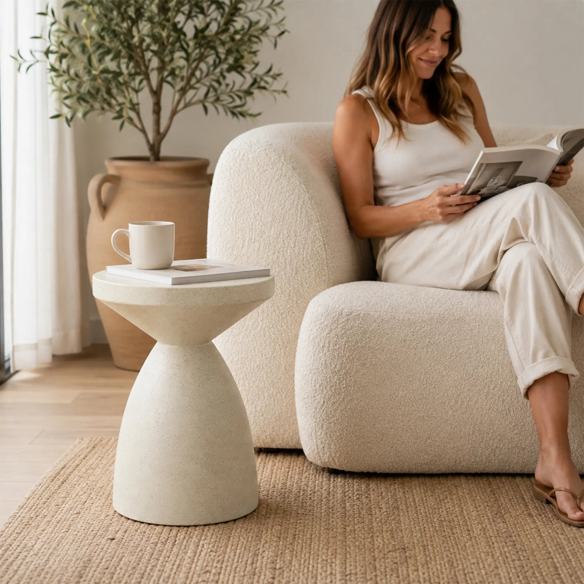 LIVARA Hourglass Round Side Table with Sculptural Pedestal Design, Durable Magnesium Cement & Speckled Finish, Modern Accent Table for Living Room - Beige