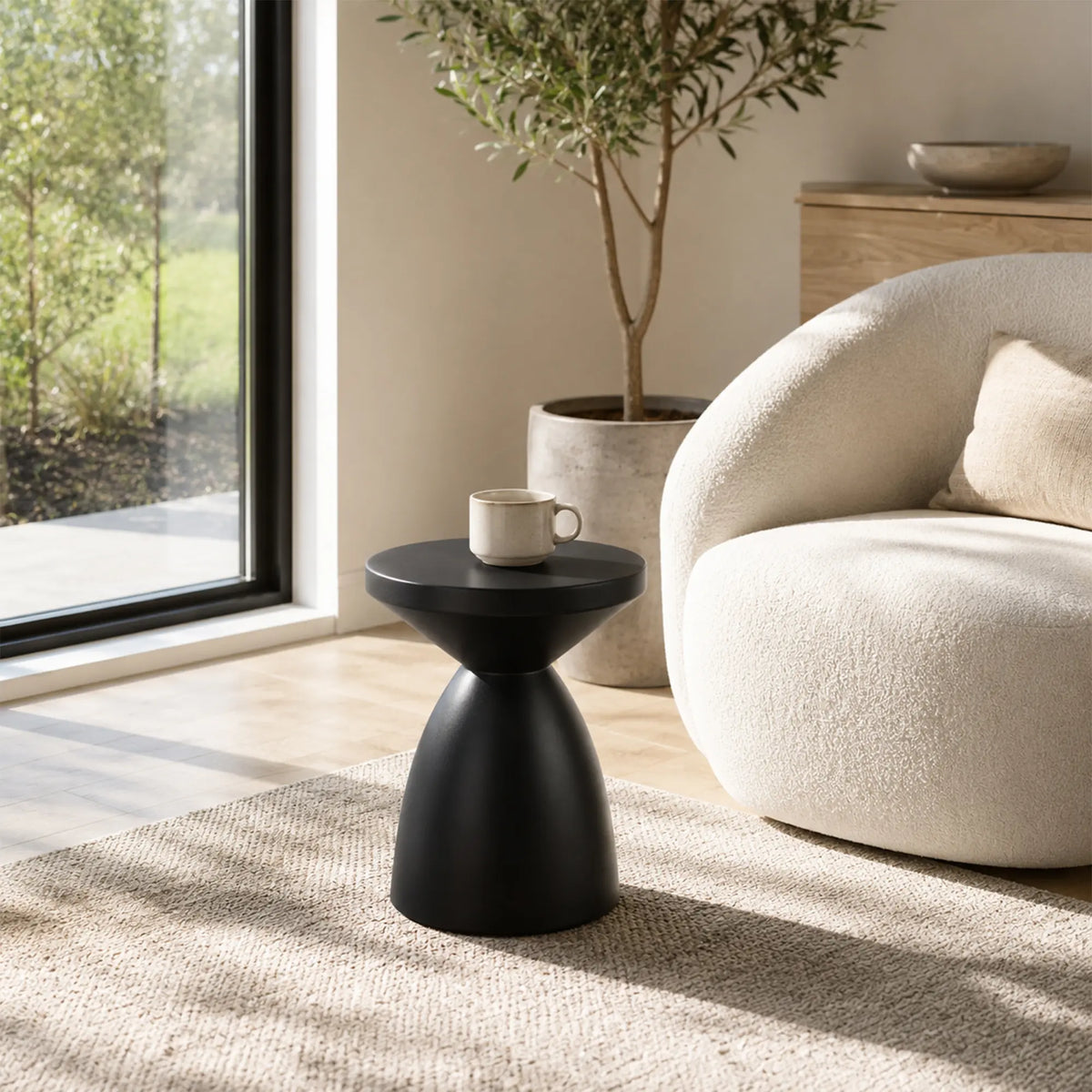 LIVARA Hourglass Round Side Table with Sculptural Pedestal Design, Durable Magnesium Cement & Speckled Finish, Modern Accent Table for Living Room - Black