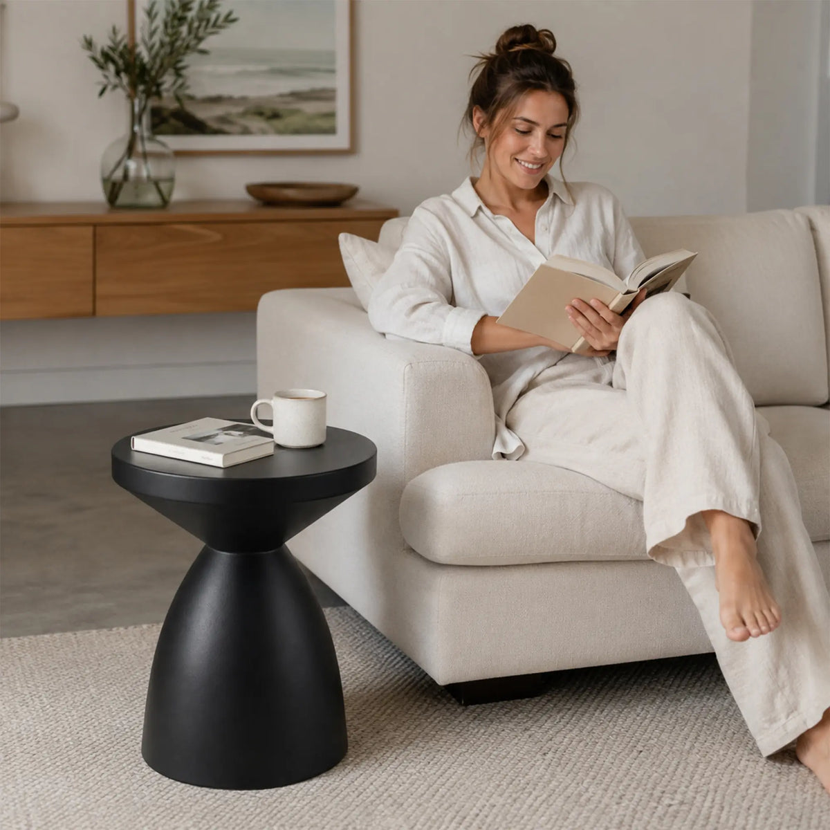 LIVARA Hourglass Round Side Table with Sculptural Pedestal Design, Durable Magnesium Cement & Speckled Finish, Modern Accent Table for Living Room - Black